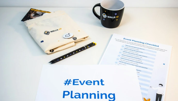 a table with a cup of coffee, napkins, and a notepad